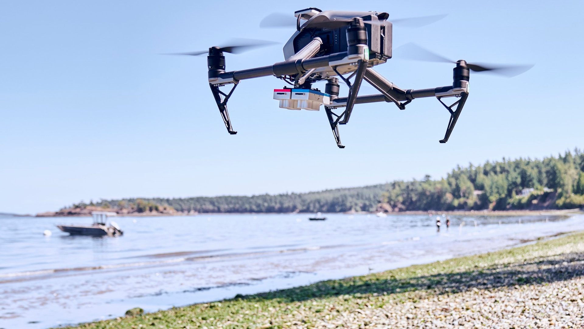 A GeoFly Lab drone with a multispectral sensor flying over a coastal seagrass site